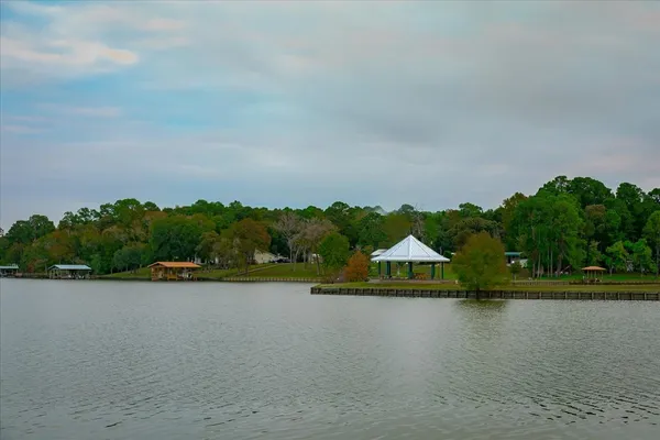 a view of a lake with houses in background