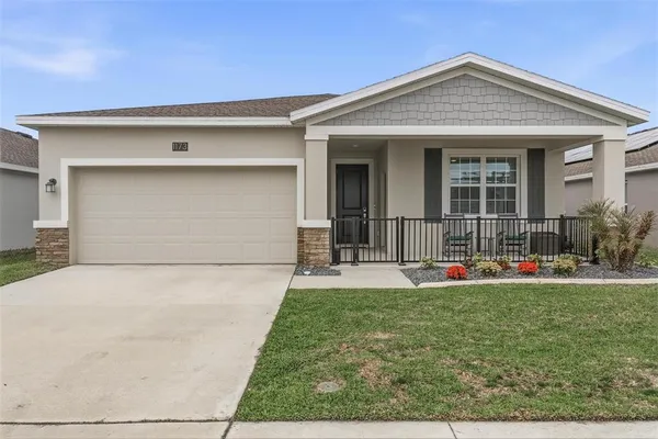 front view of a house with a yard