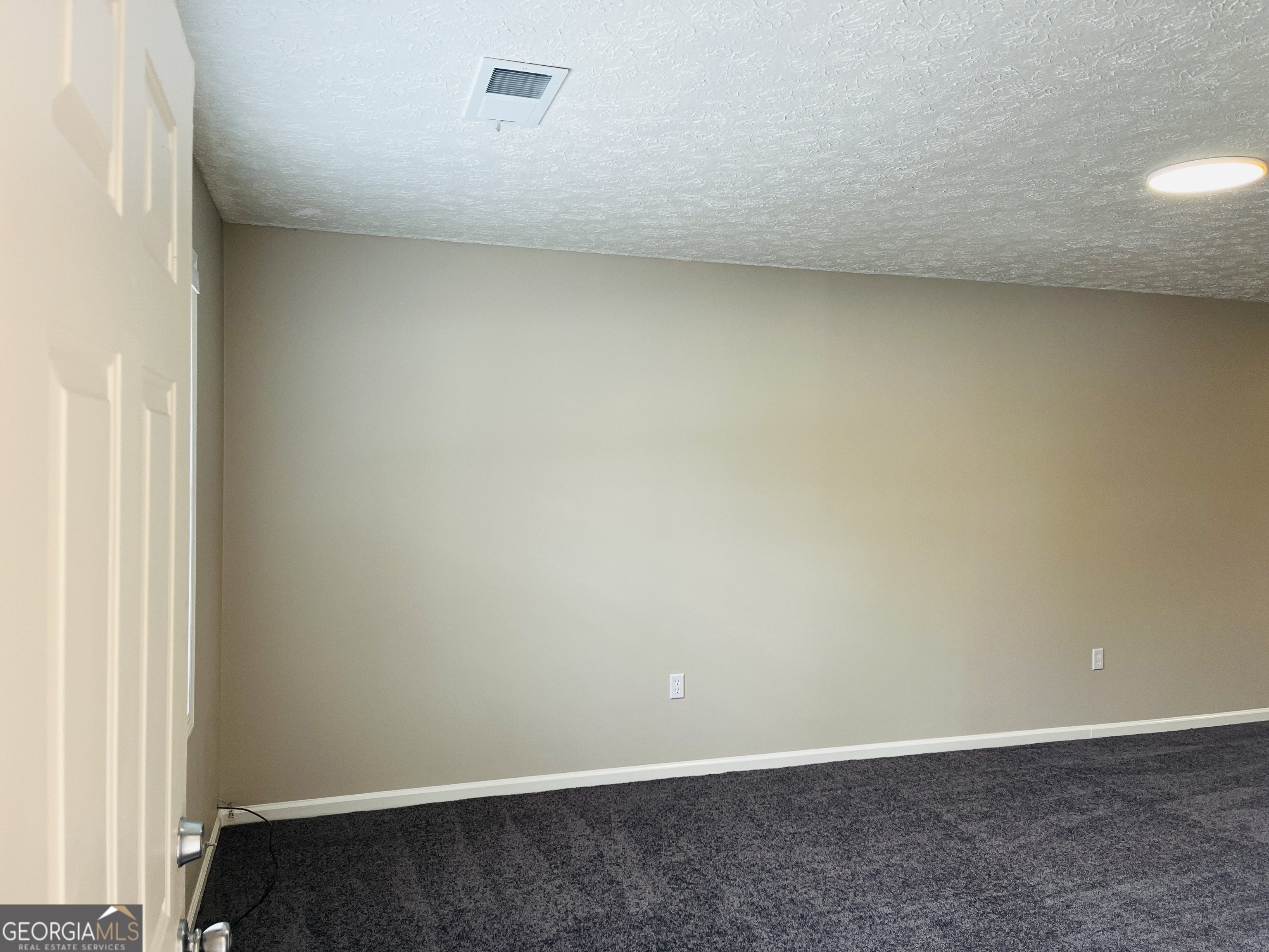 1075 Eastview Road Northeast, Unit A Conyers, GA 30012 - Photo 3 of 21 a view of an empty room