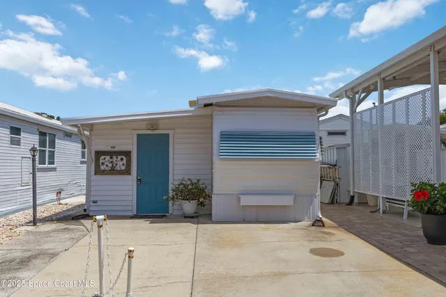 a backyard of a house with plants