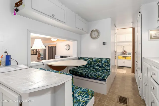 a bedroom with a bed and painting on the wall