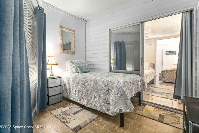 a bathroom with a toilet sink vanity and mirror