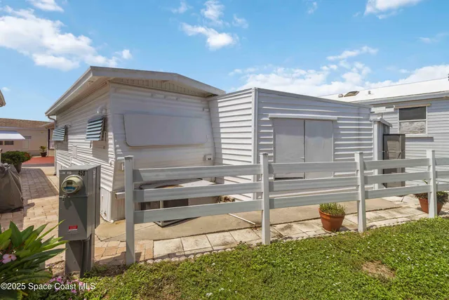 a view of a swimming pool with a garden and trees