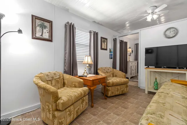 a white refrigerator freezer and a stove sitting inside of a kitchen