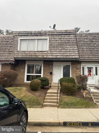 a front view of a house with garage