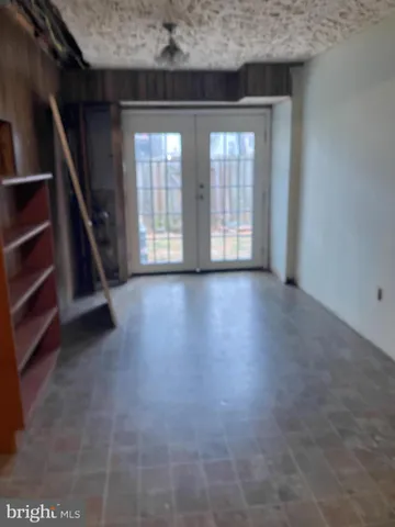 wooden floor in an empty room with a fireplace