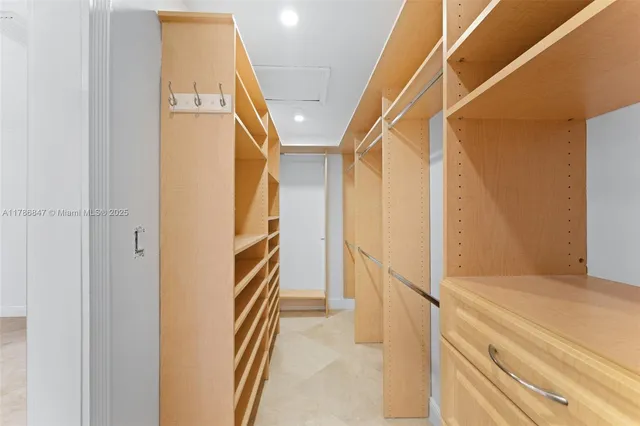 a bathroom with a sink vanity granite toilet and shower