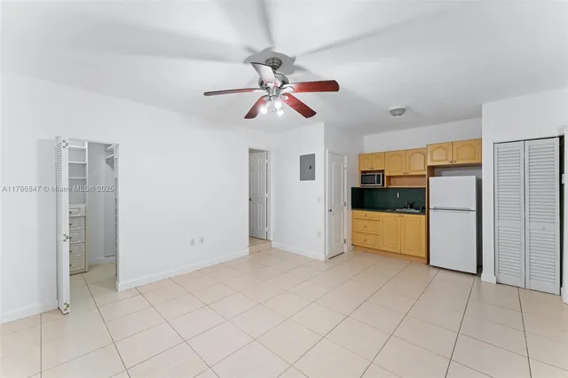 a bathroom with a sink mirror vanity and toilet