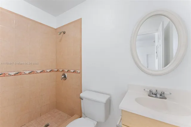 a view of a room with wooden floor and windows