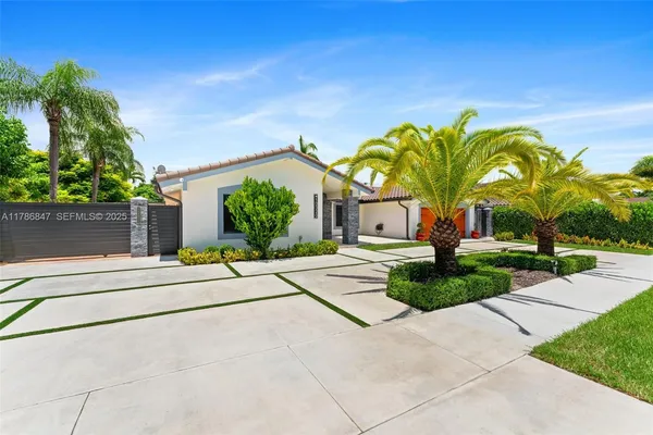 a front view of a house with garden