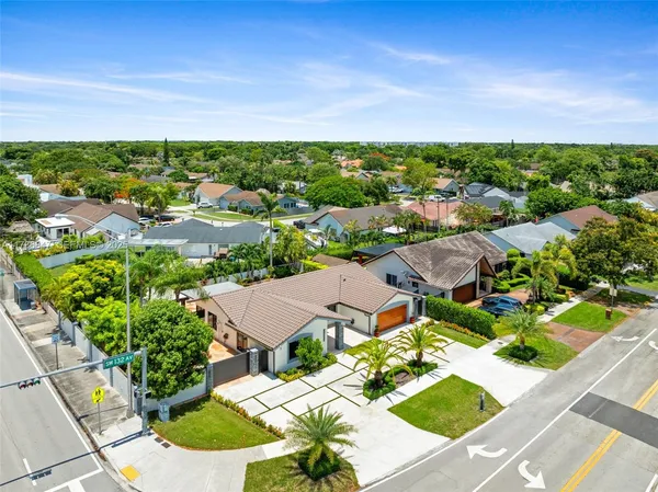 an aerial view of a house with a garden and plants