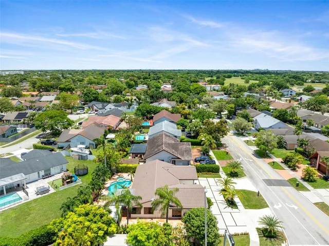 an aerial view of a city with lots of residential buildings