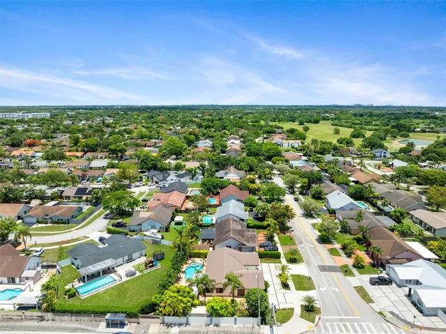 an aerial view of a house with a garden