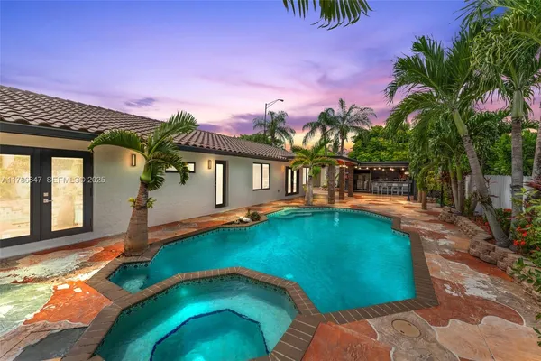 a view of a swimming pool with a patio