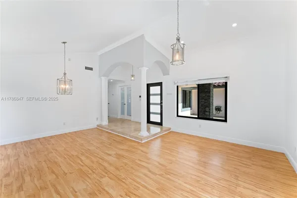 a room with a bed and a window