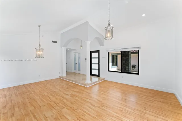 a room with a bed and a window