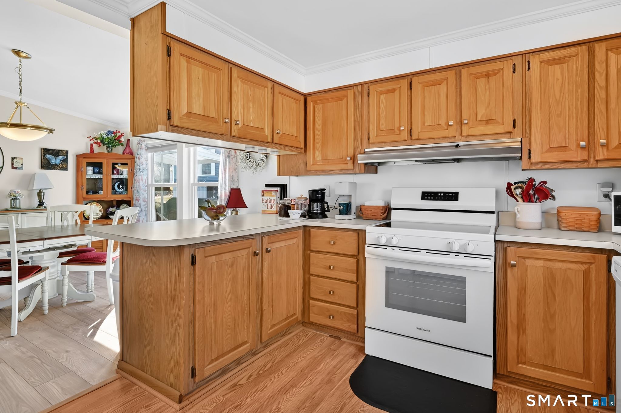 7 Eastview Road Southington, CT 06489 - Photo 15 of 36 a kitchen with stainless steel appliances granite countertop a refrigerator sink stove and cabinets
