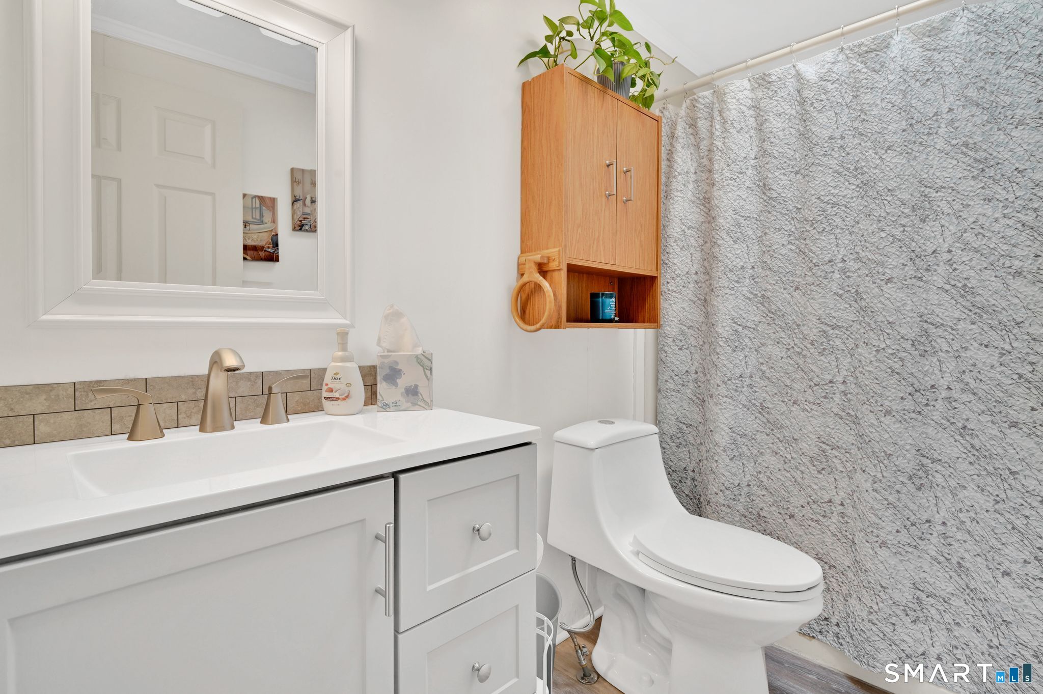 7 Eastview Road Southington, CT 06489 - Photo 19 of 36 a bathroom with a sink mirror vanity and toilet