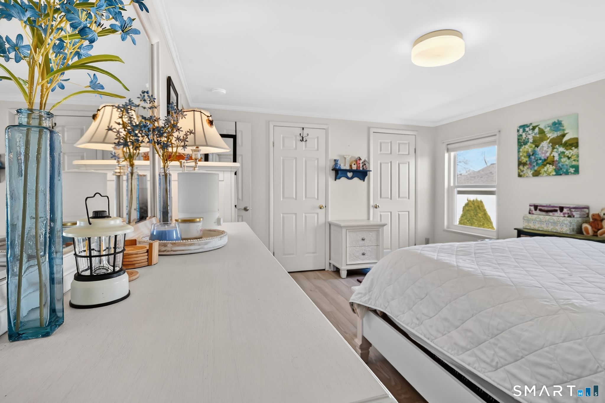 7 Eastview Road Southington, CT 06489 - Photo 24 of 36 a spacious bedroom with a bed and a chandelier