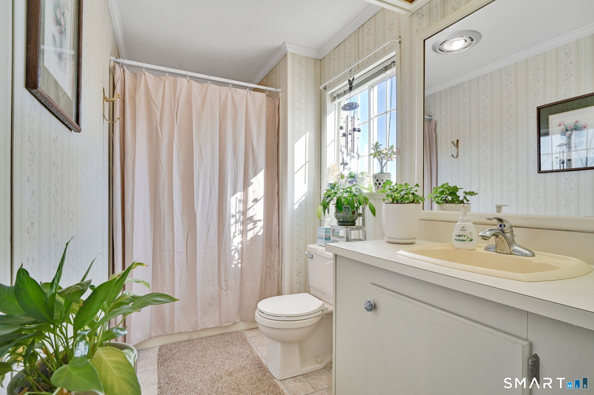 7 Eastview Road Southington, CT 06489 - Photo 27 of 36 a bathroom with a toilet a sink and a large mirror