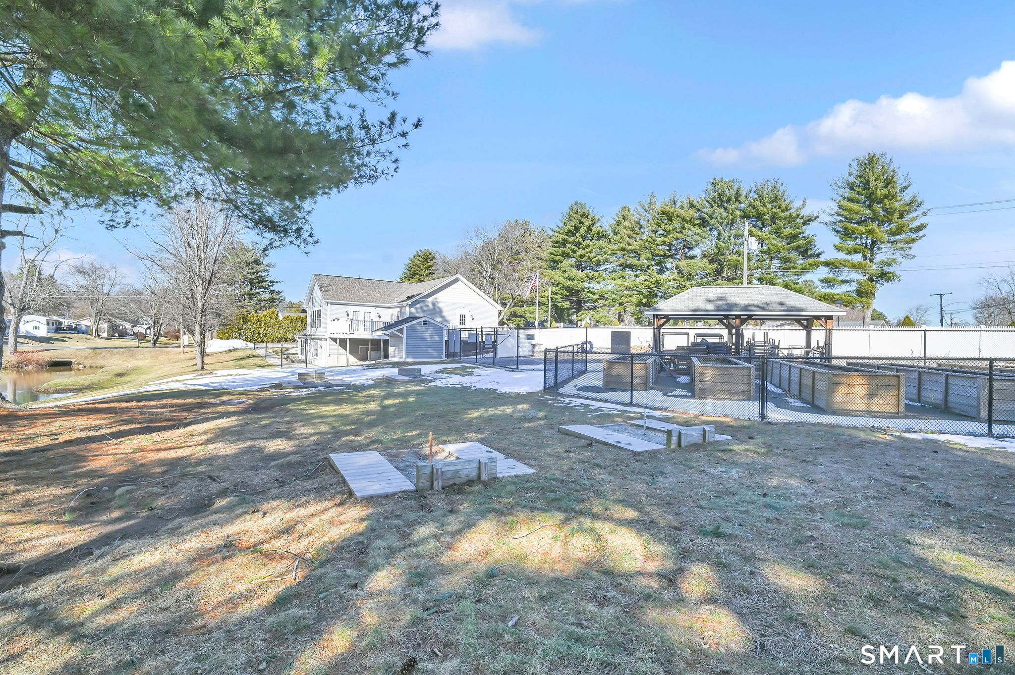 7 Eastview Road Southington, CT 06489 - Photo 35 of 36 a backyard of a house with table and chairs