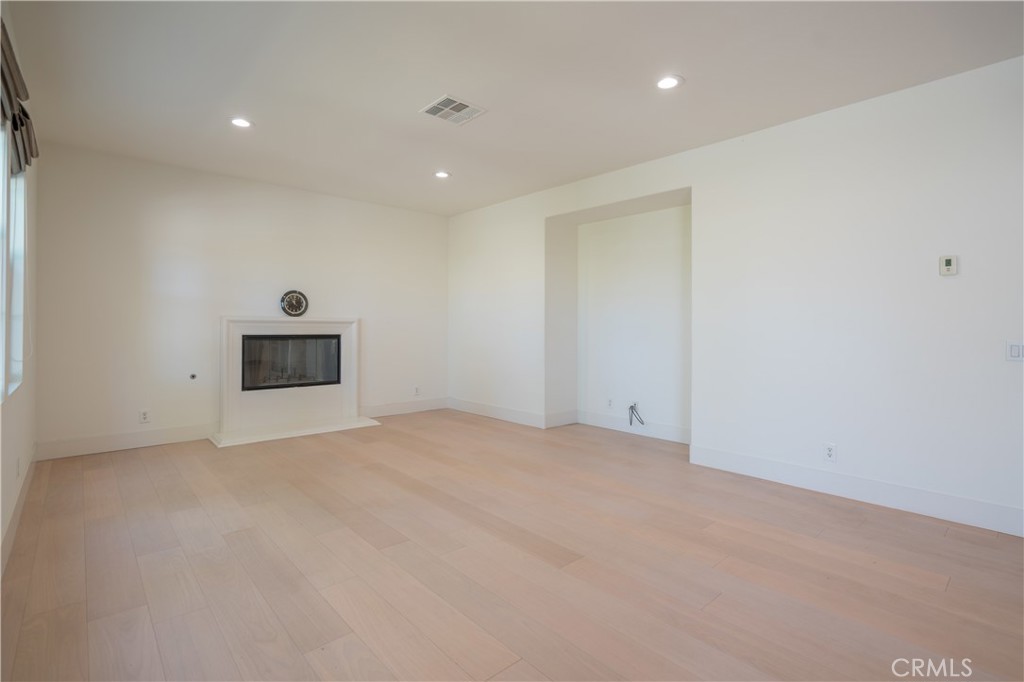8656 Harvest Place Rancho Cucamonga, CA 91730 - Photo 12 of 39 a view of empty room with wooden floor