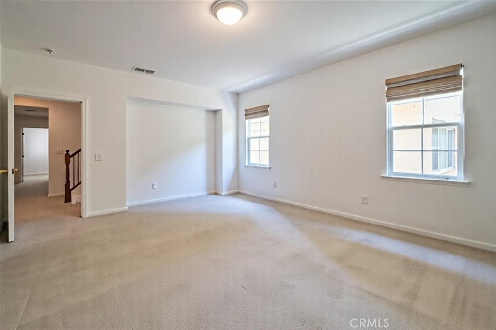 8656 Harvest Place Rancho Cucamonga, CA 91730 - Photo 17 of 39 an empty room with windows and closet
