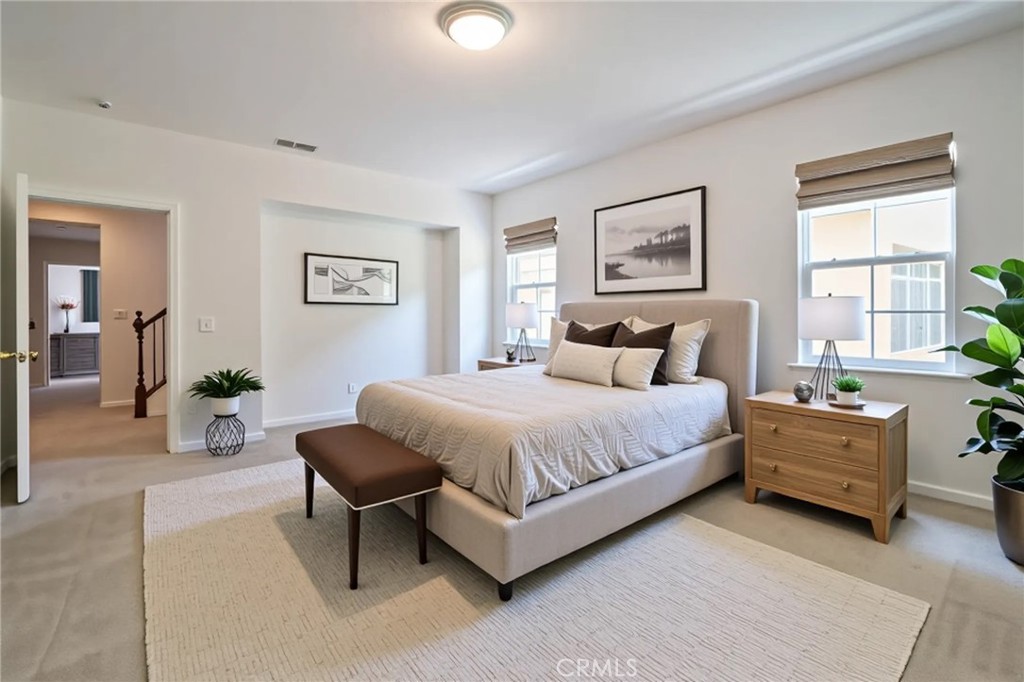 8656 Harvest Place Rancho Cucamonga, CA 91730 - Photo 18 of 39 a spacious bedroom with a bed and a couch