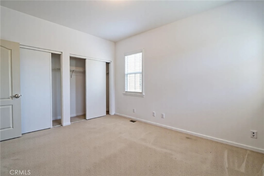 8656 Harvest Place Rancho Cucamonga, CA 91730 - Photo 23 of 39 an empty room with windows