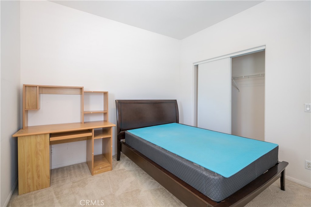 8656 Harvest Place Rancho Cucamonga, CA 91730 - Photo 24 of 39 a bedroom with a bed and window