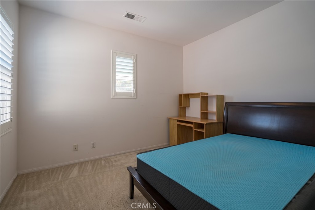8656 Harvest Place Rancho Cucamonga, CA 91730 - Photo 25 of 39 a room with a bed and window
