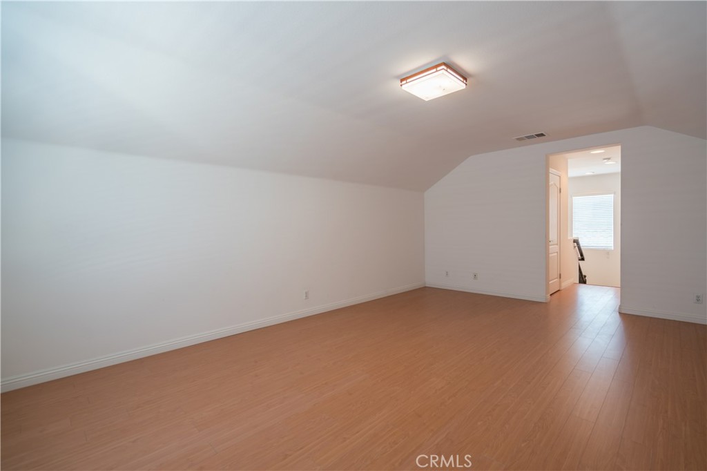 8656 Harvest Place Rancho Cucamonga, CA 91730 - Photo 28 of 39 an empty room with wooden floor and windows