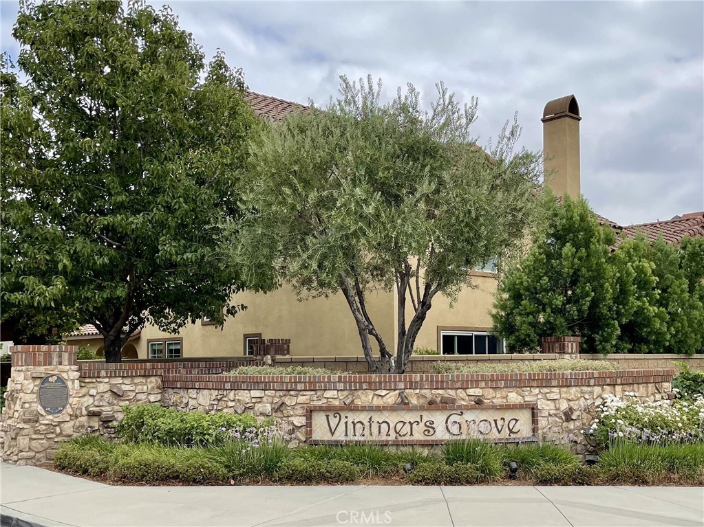8656 Harvest Place Rancho Cucamonga, CA 91730 - Photo 31 of 39 a sign board with buildings in the background