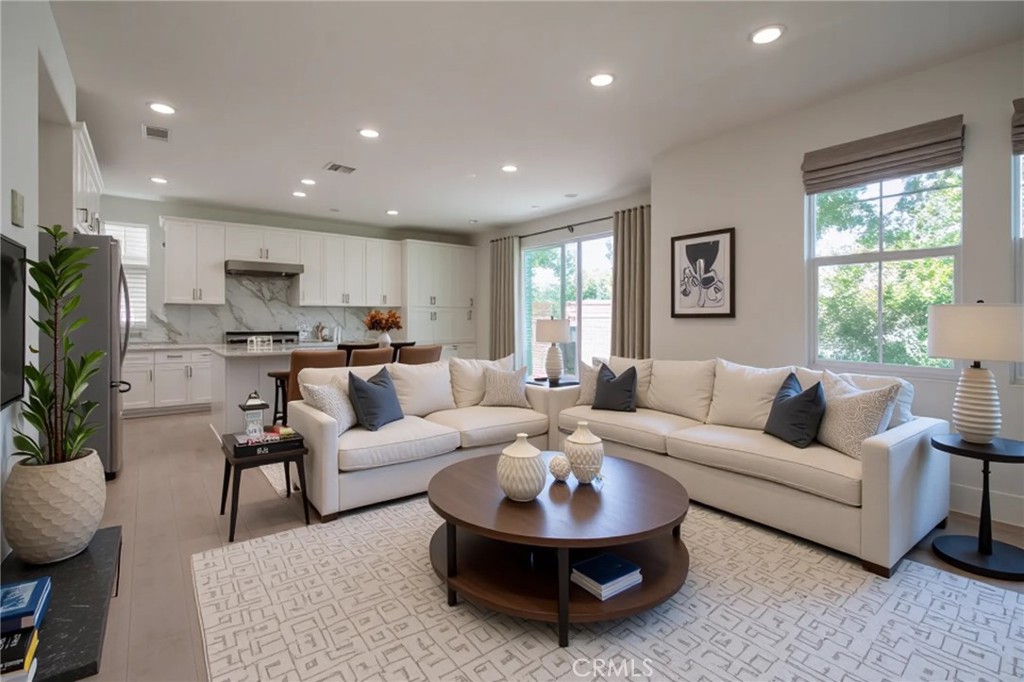 8656 Harvest Place Rancho Cucamonga, CA 91730 - Photo 8 of 39 a living room with furniture and a large window