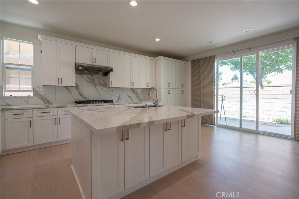 8656 Harvest Place Rancho Cucamonga, CA 91730 - Photo 10 of 39 a kitchen with sink cabinets and window