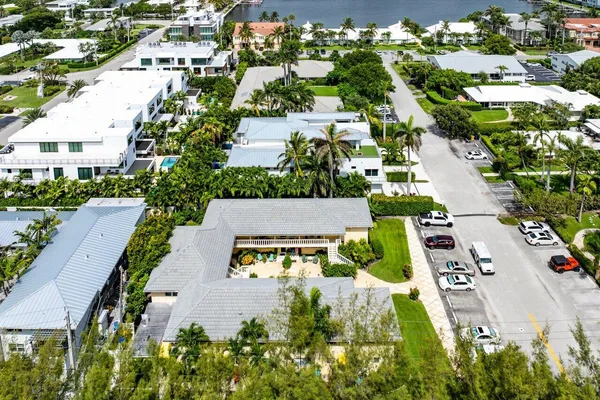 an aerial view of residential houses with outdoor space