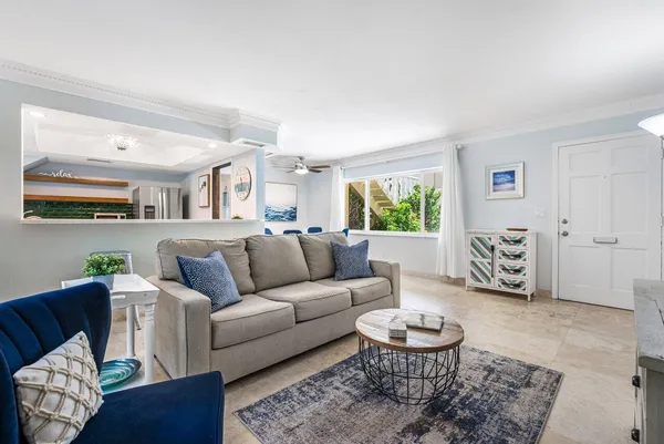 a living room with furniture and a rug