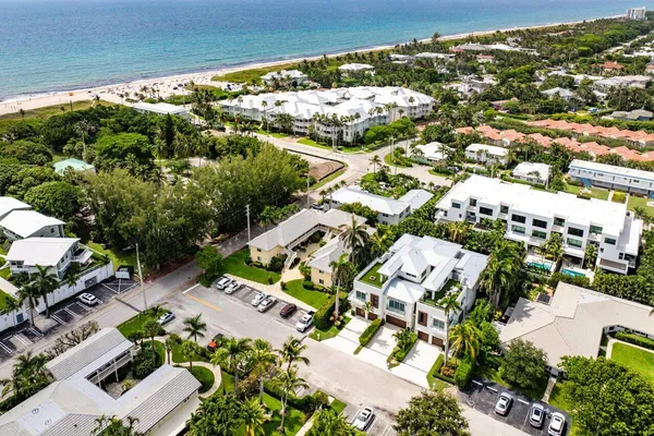 an aerial view of residential houses with outdoor space