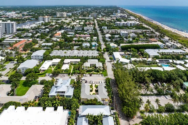 an aerial view of residential houses with outdoor space