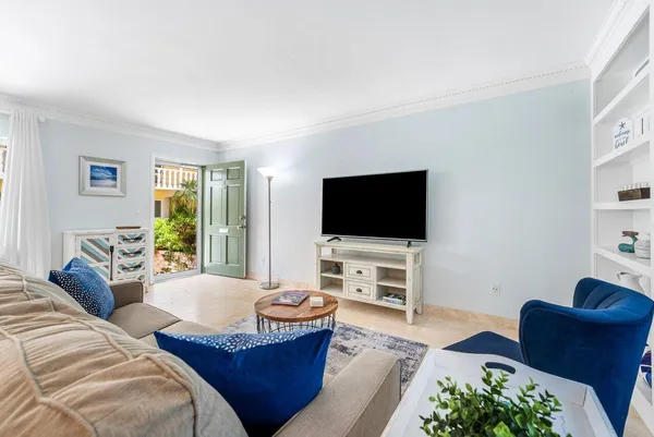 a living room with furniture and a flat screen tv
