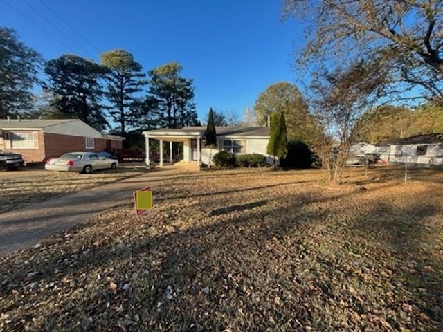 a house view with a outdoor space