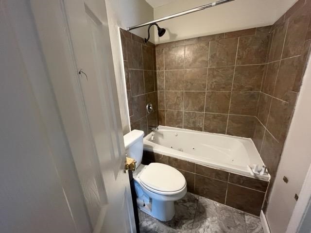 338 West Holmes Road Memphis, TN 38109 - Photo 4 of 11 a bathroom with a toilet and a shower