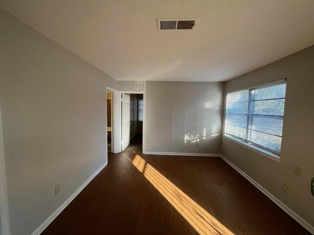 338 West Holmes Road Memphis, TN 38109 - Photo 5 of 11 an empty room with windows