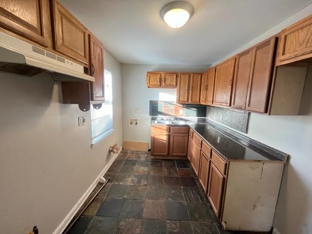 338 West Holmes Road Memphis, TN 38109 - Photo 7 of 11 a kitchen with a sink and a refrigerator