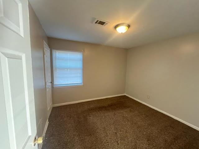 338 West Holmes Road Memphis, TN 38109 - Photo 9 of 11 an empty room with a empty space and windows