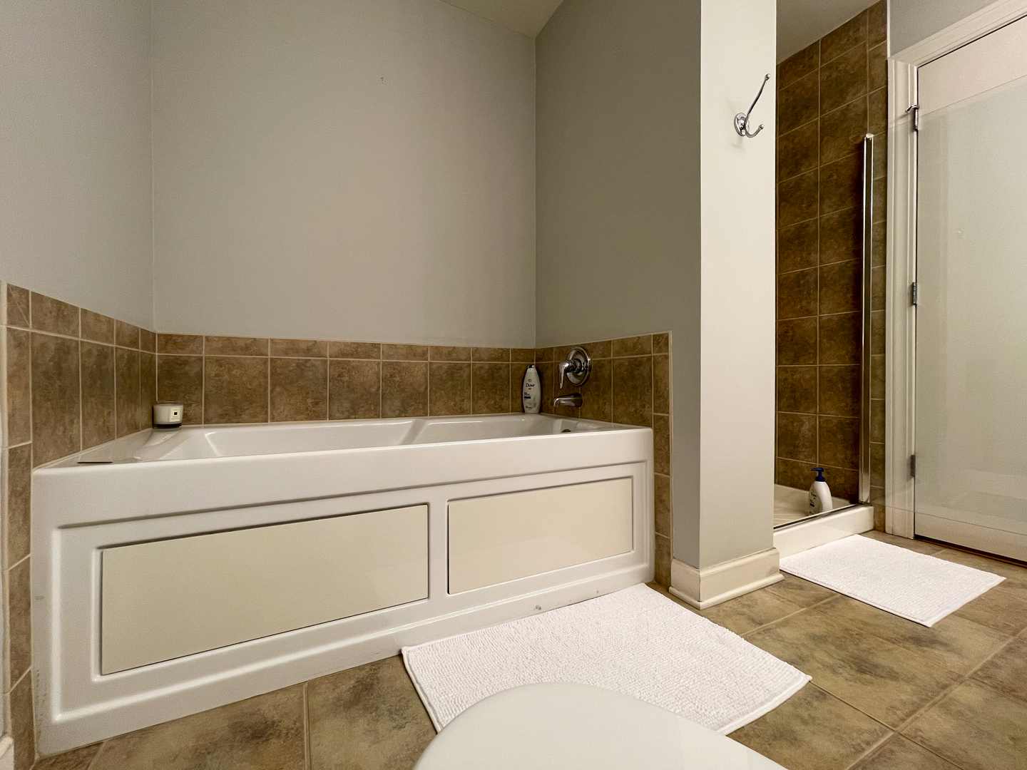 451 West Huron Street, Unit 709 Chicago, IL 60654 - Photo 13 of 19 a bathroom with a tub and shower