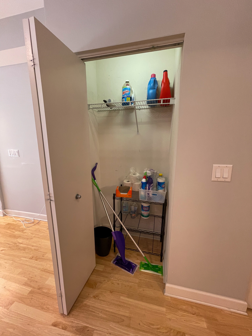 451 West Huron Street, Unit 709 Chicago, IL 60654 - Photo 16 of 19 a view of dining room with wooden floor