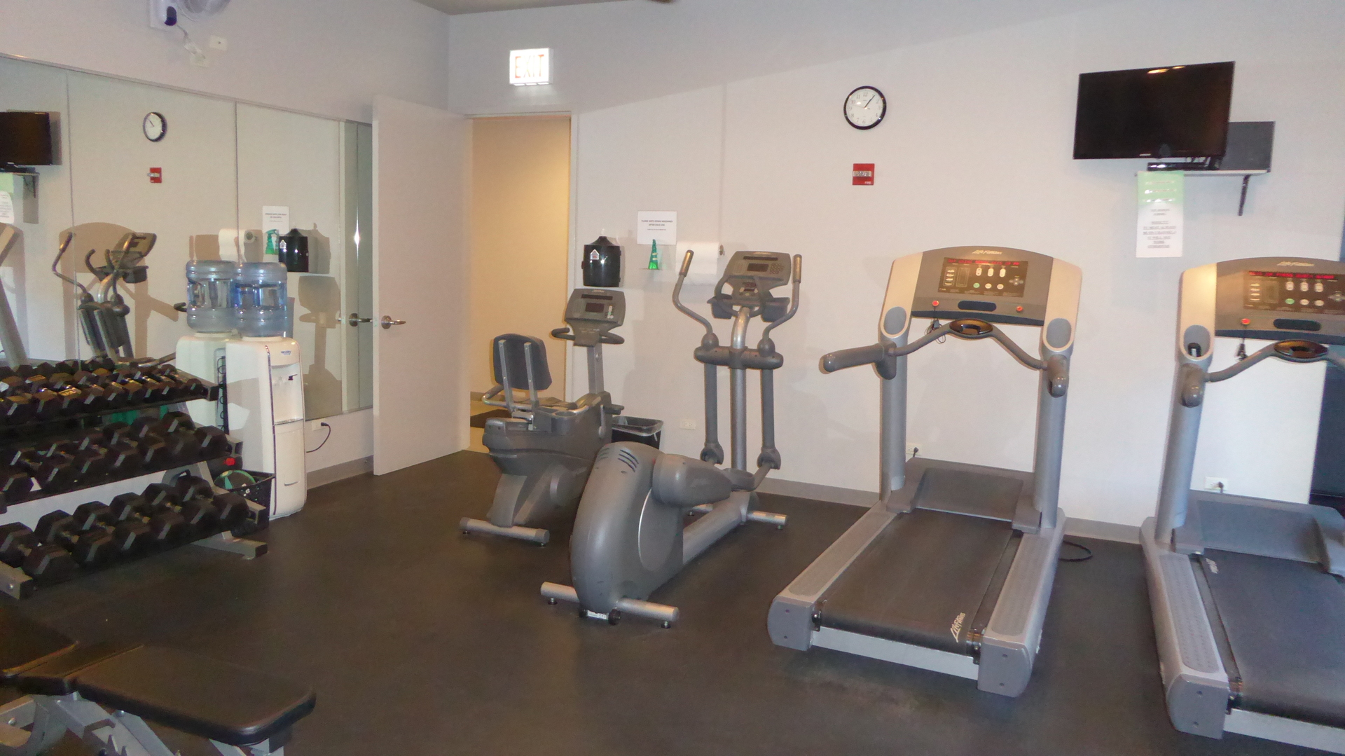 451 West Huron Street, Unit 709 Chicago, IL 60654 - Photo 19 of 19 a room with gym equipment and a flat screen tv