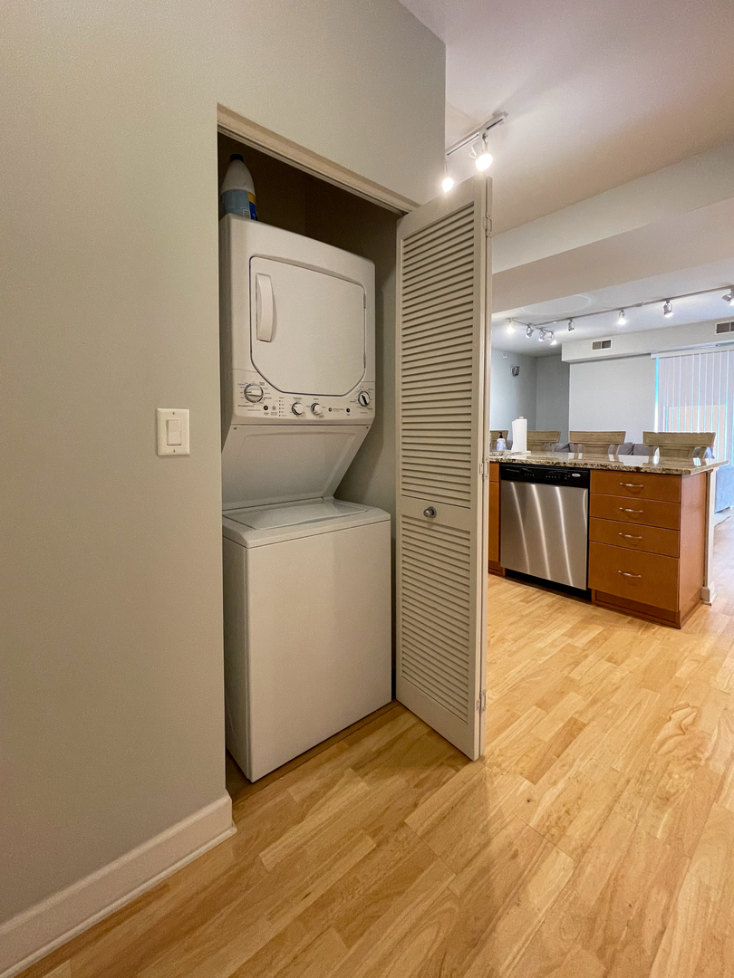451 West Huron Street, Unit 709 Chicago, IL 60654 - Photo 5 of 19 a view of a storage & utility room with wooden floor