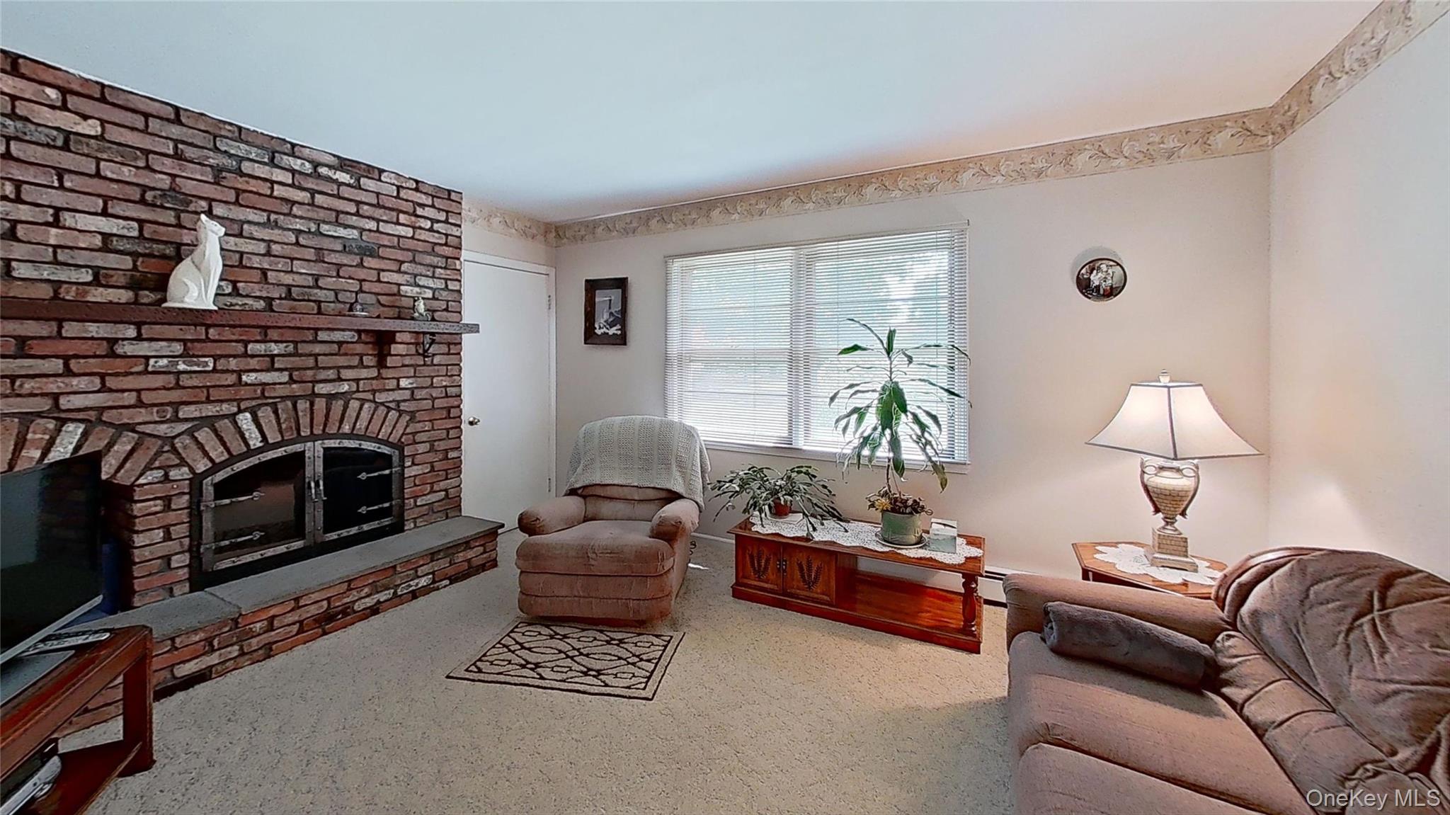 347 Miller Place Road Miller Place, NY 11764 - Photo 9 of 29 Enjoy the warmth from the wood-burning fireplace.
